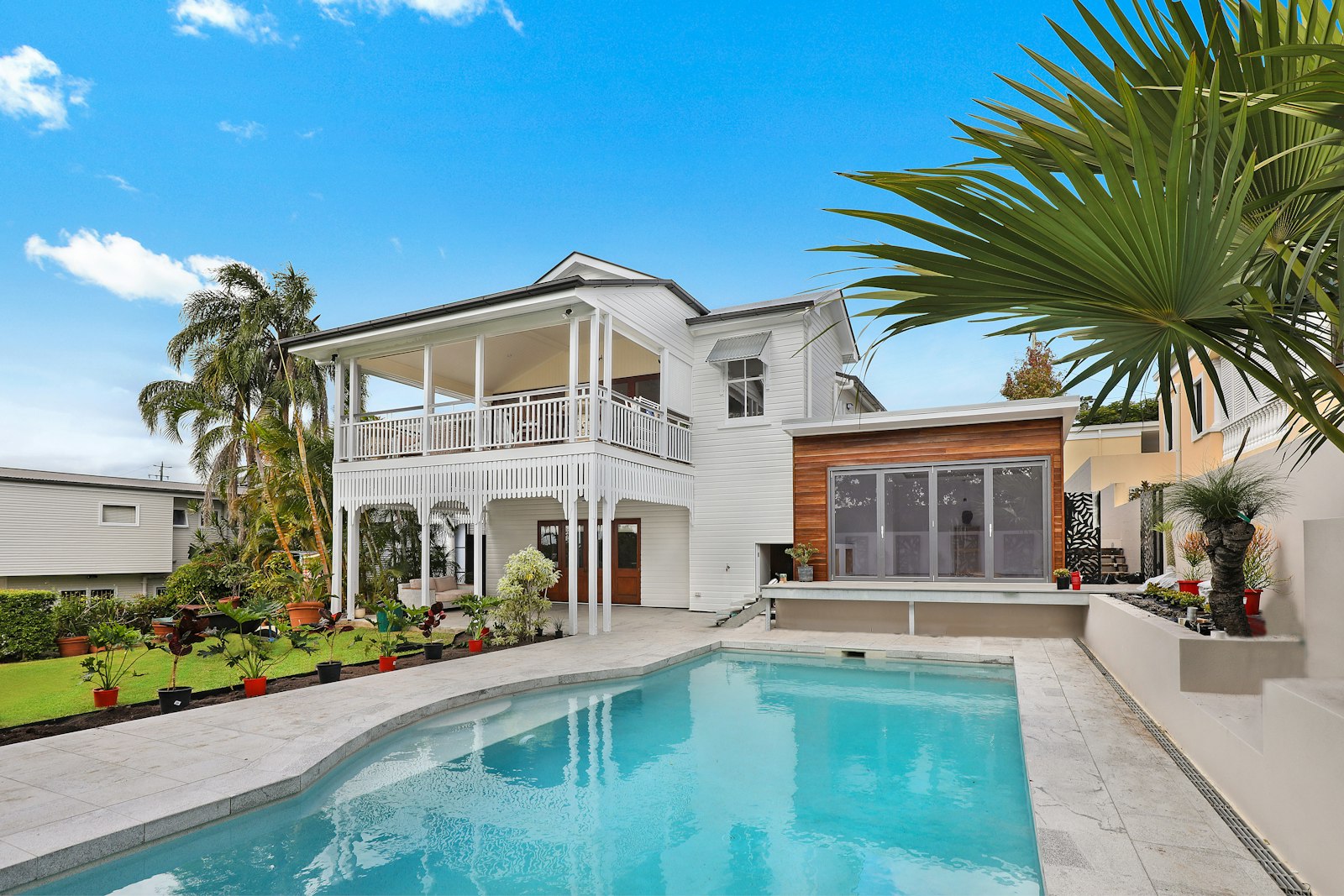 Beautiful Arizona home with a pool, palm trees and clean windows