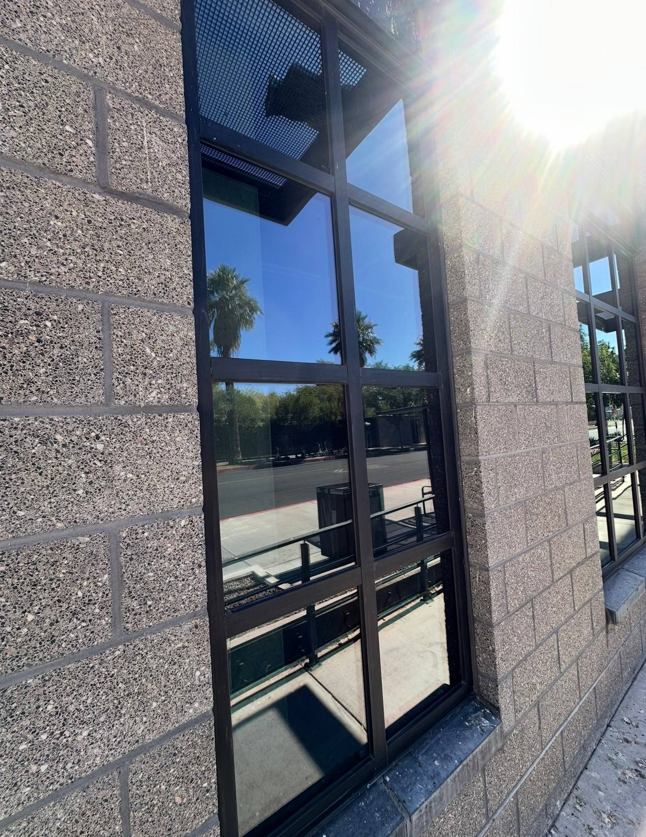The same commercial window after cleaning, glass clear